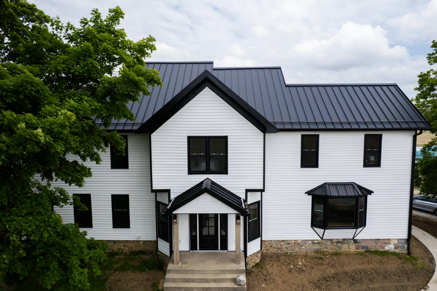 Siding installation documented in Plum Creek